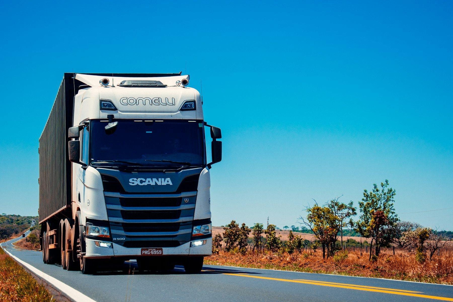 Heavy truck on an open highway, representative of road cargo transport